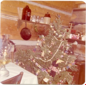 Christmas tree inside log cabin exhibit at Heritage Village, [between 1971 and 1979] thumbnail