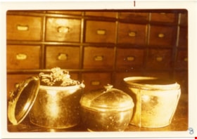 Materia medica containers on counter of Way Sang Yuen Wat Kee & Co, 1975 thumbnail