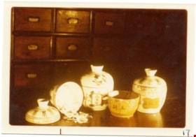 Porcelain vessels on wooden counter, 1975 thumbnail
