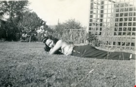 Suey Ying Jung (Laura) lying on grass, [between 1946 and 1955] thumbnail