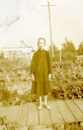 Gee Shee Jung standing on plankboard, [between 1942 and 1952] thumbnail