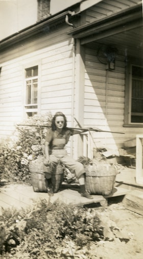 Suey Ying Jung (Laura) with produce baskets, [between 1940 and 1942] thumbnail