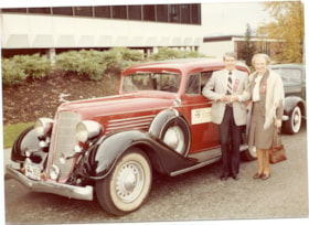 Betty and Doug Forbes in front a red vintage Buick at the Heritage Village Museum's 10th anniversary., Nov. 1, 1981 thumbnail
