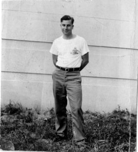 Gerald F. Sanders outside house, 1942 thumbnail