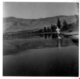Gerald Sanders wading in a lake, [196-] thumbnail