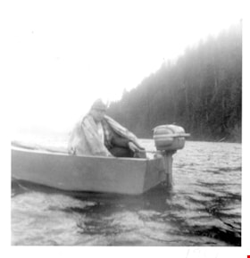 Kerry Sanders sitting in a motor boat, 1967 thumbnail