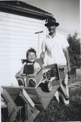 John and Janice Wuzinski, with Janice in wheelbarrow, 1949 thumbnail