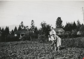 John and Frances Wuzinski in their strawberry field, May 1946 thumbnail