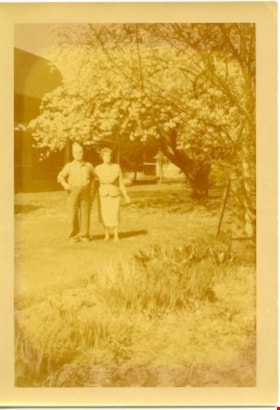 William Parker and Sarah Love Parker in garden at Love farmhouse on Cumberland Avenue, 1953 thumbnail