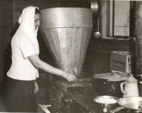 Besant Kaur Siddoo at her kitchen stove, [194-] (date of original), copied 2004 thumbnail