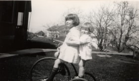 Eleanor and Louise riding tricycle, [1930] (date of original), copied 2004 thumbnail
