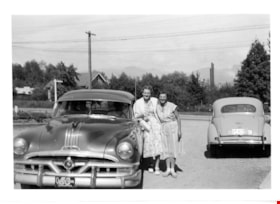 Reta Martin with woman at auto court, 1953 thumbnail