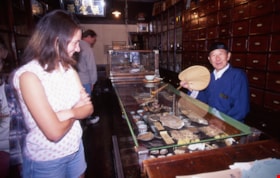 Visitors inside Chinese herbalist shop, May 1997 thumbnail