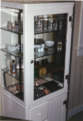 Display cabinet with dental specimans and equipment, [198-] thumbnail