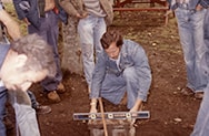 Surveying for the construction of a log cabin, [1976] thumbnail