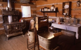 Interior of log cabin, [198-] thumbnail