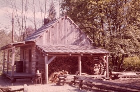 Log cabin and fence, [198-] thumbnail