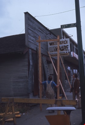 Removing false front from Whitechurch Hardware building, Aug. 1974 thumbnail