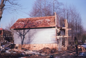 Painting new false front of Whitechurch Hardware building, Feb. 1975 thumbnail