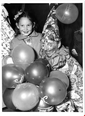 Clown with child on opening day, 5 May 1954 thumbnail