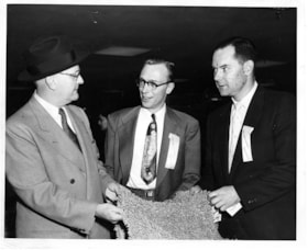 Advertising manager of Simpsons-Sears with two men, 5 May 1954 thumbnail
