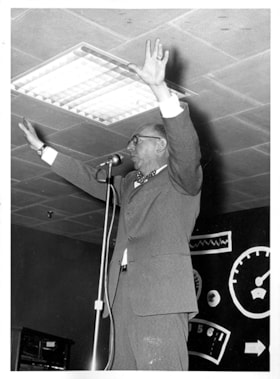 Man speaking into microphone, [1959] thumbnail