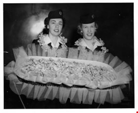 Trans Canada Airlines staff with tray of orchids, 5 May 1954 thumbnail