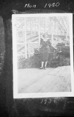 Dora Robertson standing in front of amusement ride, [between 1936 and 1940] (date of original), copied 1996 thumbnail