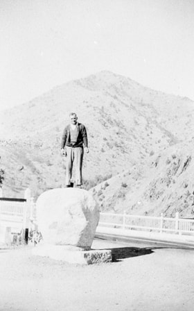 Jimmy Robertson on boulder along Pacific Highway in the Siskiyou Mountains, [1936] (date of original), copied 1996 thumbnail