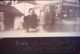 Dora and Jimmy Robertson standing next to a car, [1936] (date of original), copied 1996 thumbnail