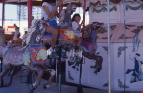 Children riding C.W. Parker no. 119 carousel at PNE, 1989 thumbnail