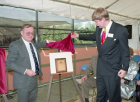 Unveiling commemorative plaque during opening ceremonies for carousel, 27 Mar. 1993 thumbnail