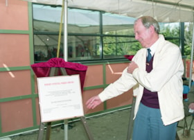 Don Brown unveiling commemorative citation during opening ceremonies for carousel, 27 Mar. 1993 thumbnail