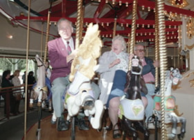 Don Wrigley riding carousel at opening, 27 Mar. 1993 thumbnail