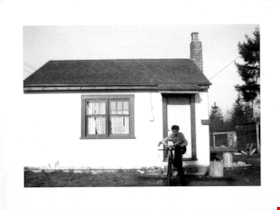 Steve McPherson in front of John Archibald house, [between 1947 and 1949] thumbnail