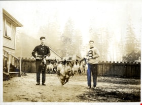 Two men holding dead geese and waterfowl, [190-] thumbnail