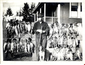 Man with dead fowl in front of the Whiting family home, [190-] thumbnail