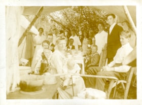 Love and Whiting families picnicing under tent, [c. 1910] thumbnail