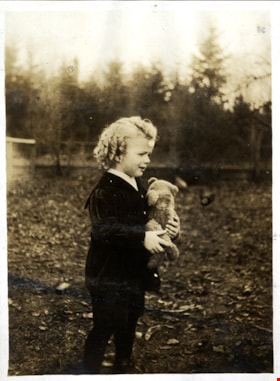 Kenneth McKenzie holding teddy bear, [between 1915 and 1917] thumbnail
