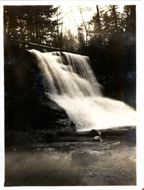 Waterfall with narrow bridge over top, [c. 1910] thumbnail