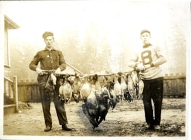 Two men with dead waterfowl, [c. 1915] thumbnail
