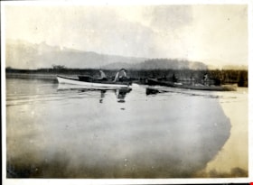 Boat towing canoe on lake, [191-] thumbnail
