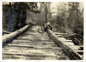 Man on wooden bridge, [191-] thumbnail