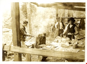 Men preparing food under wooden shelter, [191-] thumbnail