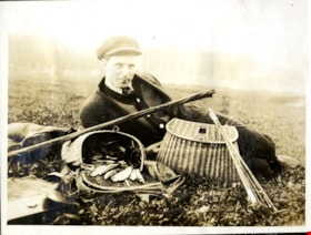 Man with fish and fish baskets, [191-] thumbnail