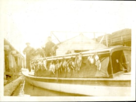 Bob on boat with dead fowl, [191-] thumbnail