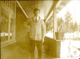 Bob Love on porch, [191-] thumbnail