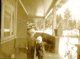 Two children on porch, [192-] thumbnail