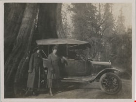 Two women next to hollow tree, [191-] thumbnail