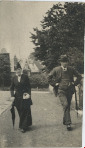 Man and woman walking down street in Swanage, 1917 thumbnail
